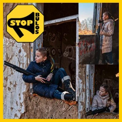 Niña Ucraniana con fusil y piruleta.